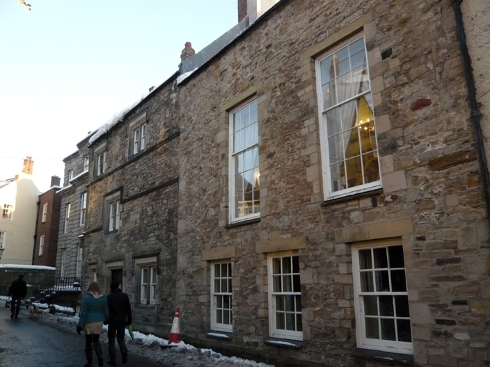 The large windows on the right side of this photo are of one of the reception rooms at Bowes House. Only grand residences would have rooms of such a large scale.